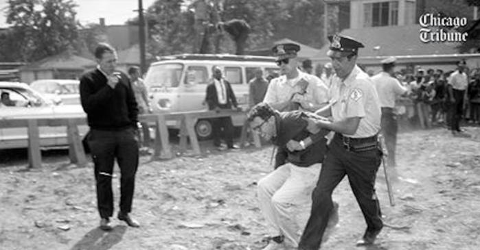 Chicago police officers carry protester Bernie Sanders, 21, in August 1963 to a police wagon from a civil rights demonstration.
